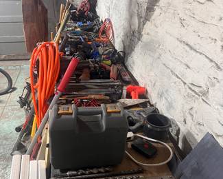 Lots of tools, some gardening equipment, kuat bike rack, folding tables and lots of chairs, washers game