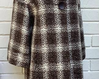 Vintage Oversized Plaid Coat Stylish vintage plaid coat featuring an oversized collar, bold buttons, and a timeless brown and ivory woven pattern. A beautiful statement coat with classic Mid-Century styling that's perfect for fall and winter.