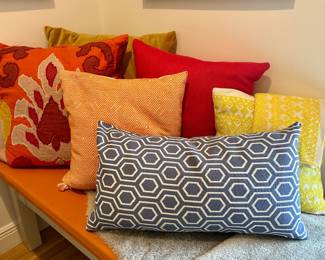 The big orange and burgundy pillow is sold.