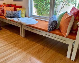 The big orange and burgundy pillows are sold.