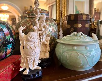 The Buddha and green covered container are sold.