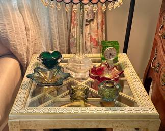 The red bowl on the right and brass planter under the table are sold.