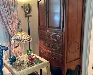 The armoire/cabinet and brass planter are sold.