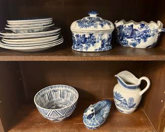 The covered jar and bowl on the top shelf and the duck on the bottom shelf are sold.