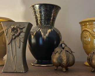 The yellow planters and brass acorns are sold.