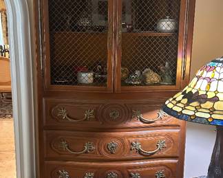 The armoire/cabinet, fish bowl, lamp and most of the items on the cabinet are sold.