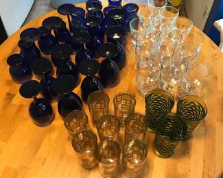 Cobalt blue goblets and tumblers, mid-century green glasses, La Rochere bumblebee goblets, and Audubon rare bird goblets. MCM green and gold glasses no longer available.