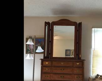 Wooden chest of drawers and trifold mirror