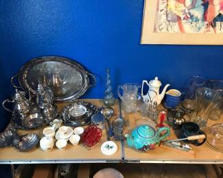 Silver plated service including sugar and creamer and two pitchers.