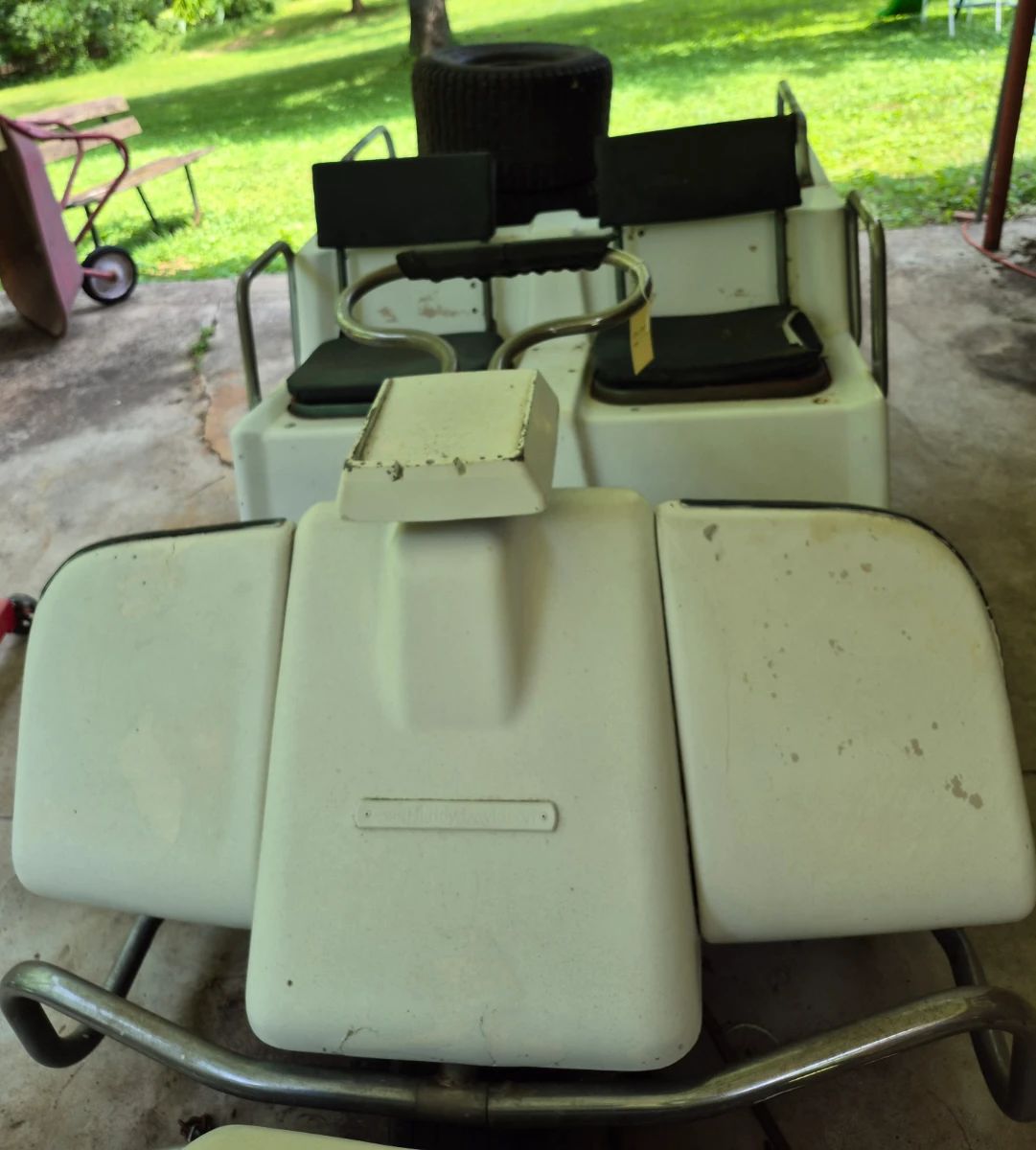 Vintage Harley-Davidson golf cart with black seata