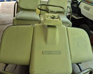 Vintage Harley-Davidson golf cart with white seats