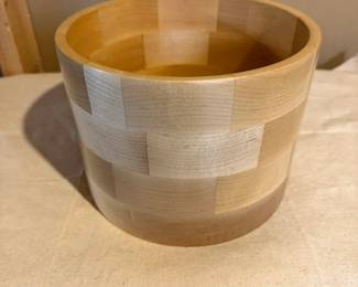 Large handcrafted segmented hardwood vessel showcasing exceptional woodturning craftsmanship with striking natural wood grain and geometric construction.