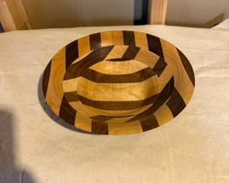 Unique handcrafted segmented hardwood bowl featuring an intricate geometric inlay pattern. A one-of-a-kind artisan woodturning piece.