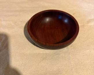 Beautiful solid hardwood turned bowl with rich reddish-brown finish. Perfect for serving, display, or as a decorative accent piece.