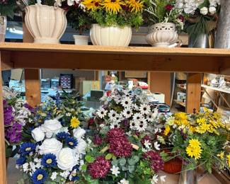 Large collection of handcrafted floral centerpieces, decorative baskets, ceramic planters, silk flowers, seasonal arrangements, and farmhouse home décor.