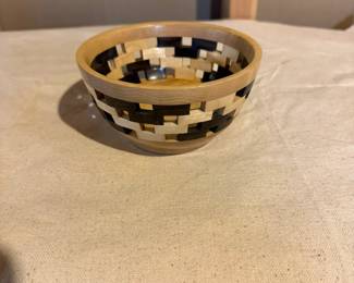 Decorative open-weave segmented wood basket handcrafted from contrasting hardwoods. Stunning artisan woodworking perfect for display or serving.