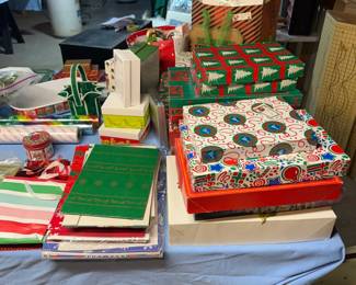 Large selection of gift boxes, holiday gift bags, wrapping paper, tissue paper, bows, ribbon, and Christmas gift wrapping supplies in a variety of sizes and styles
