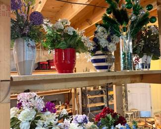 Additional designer floral arrangements in decorative vases including patriotic décor, seasonal greenery, hydrangeas, topiary accents, and elegant centerpiece displays.