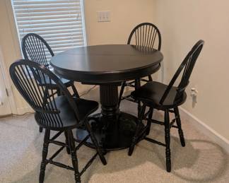 Tall black table with chairs