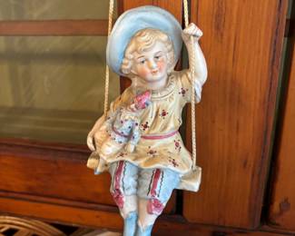 German porcelain on swing