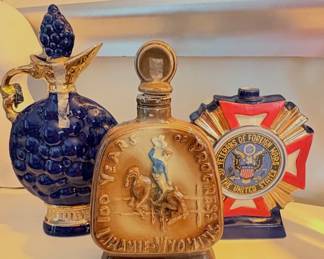 1960s cobalt Jim Beam blue glass decanter  1968 Jim Beam whiskey decanter -Centennial Jubilee of Laramie, Wyoming 1973 Ezra Brooks ceramic decanter commemorating the Veterans of Foreign Wars.