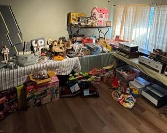Bedroom filled with 70-90s toys and electronics