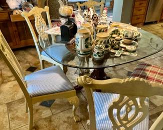 Glass top table with ornate wood base 