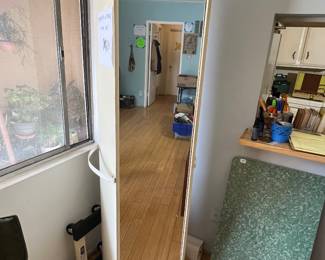 Mirror with storage that spins 