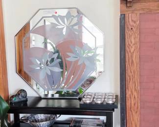 Black side table with drawers and etched floral mirror