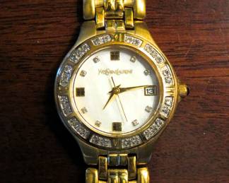 Yves Saint Laurent gold tone watch