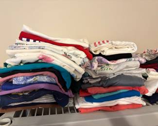 More clothing in bedroom off living area