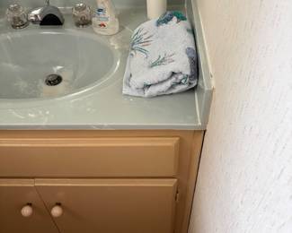 Bathroom adjacent to laundry room