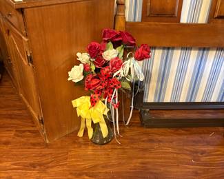 Flowers in container, small cabinet- same bedroom