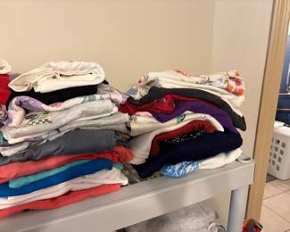 More clothing in bedroom off living area