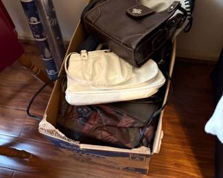 Purses in bedroom off living area
