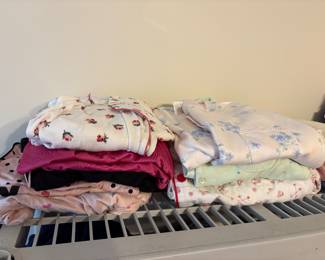 More clothing in bedroom off living area