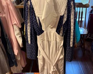 Clothing on racks in bedroom off living area