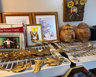 Office off kitchen - pictures, birds, butterfly picture, vintage wooden picture on wall, & coconut carvings 