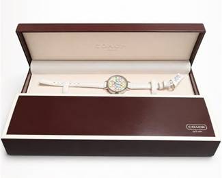 Lot 956: Coach Women's Signature "C" Dial Wristwatch, White Strap — current bid $32