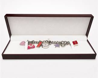 Lot 958: Coach Stainless Steel Charm Bracelet Wristwatch — current bid $11