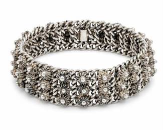 Lot 652: Wide Silver-Tone Floral Filigree Link Bracelet — current bid $8