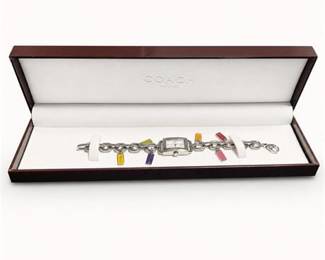 Lot 957: Coach Stainless Steel Charm Bracelet Quartz Wristwatch — current bid $28