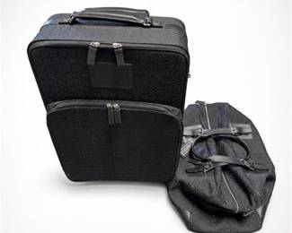 Lot 31: Coach Black Signature C Jacquard Two-Piece Luggage Set — current bid $67
