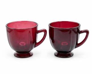 Lot 680: Pair of Amethyst Pressed Glass Cups and Saucers — current bid $5