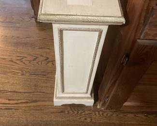 White and gold pedestal