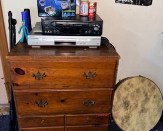 Small dresser, VR googles, Sharp VHS player, DVD player, flashlights