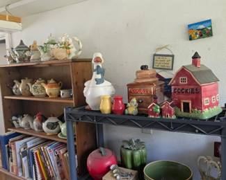 Cozy collection of farmhouse décor, cookie jars, cookbooks, pottery, serving pieces, and decorative household accents.
