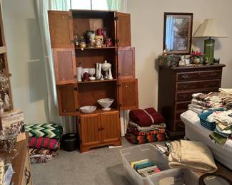 Small pantry (yes, in the bedroom for display!) books, crocheted throws, blankets