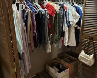 closet full or ladies clothes, shoes and hats