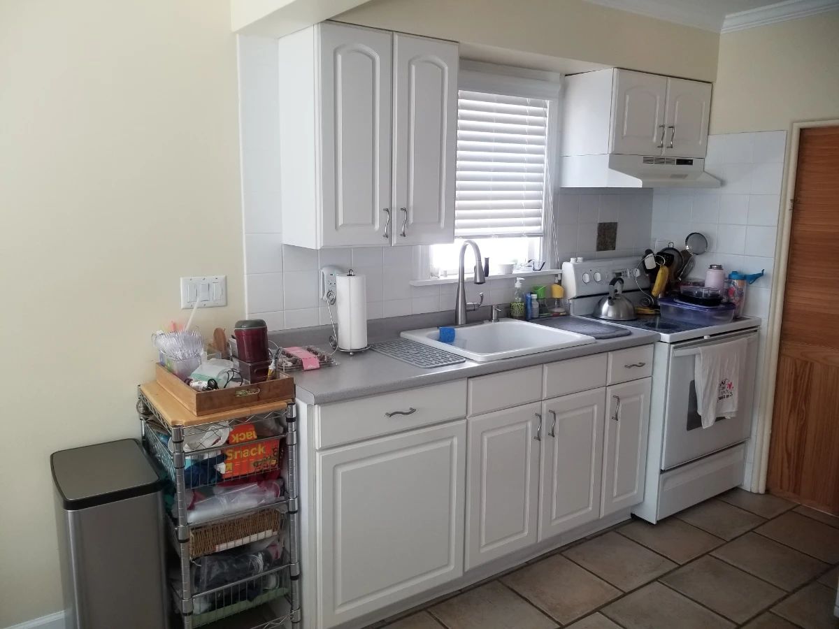 Cute white kitchen with nice cabinets